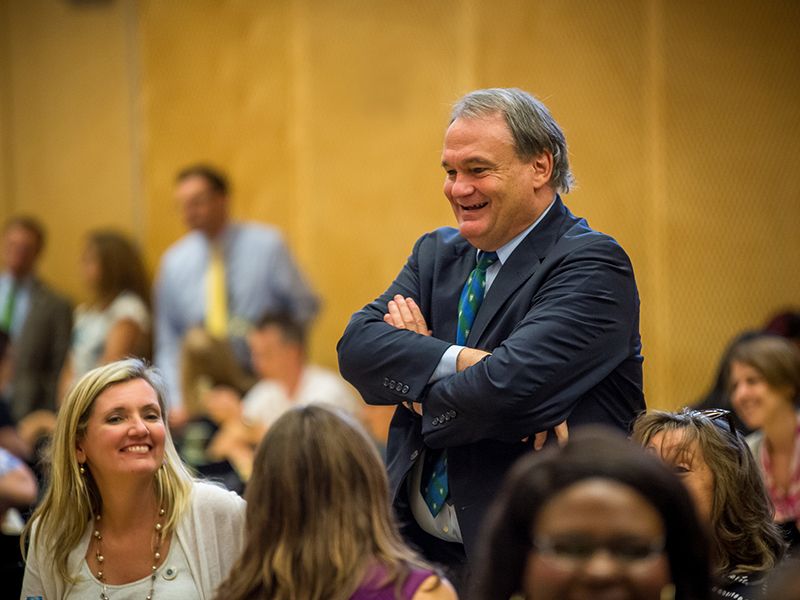 President Fitts talks with staff at the Poboys with the President event