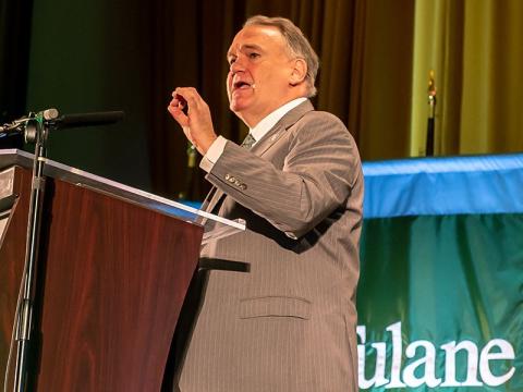 President Fitts speaks at the podium